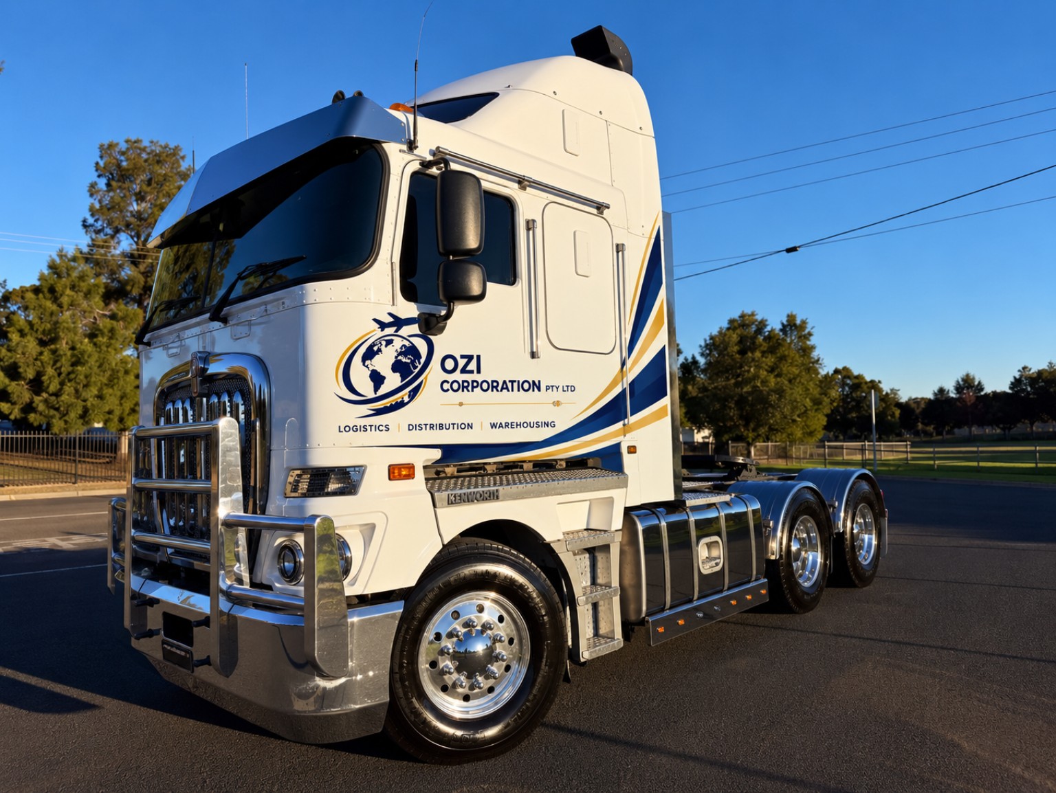 Ozi-branded Kenworth prime mover with Ozi Corporation blue and gold branding